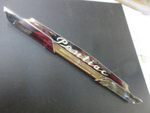 Load image into Gallery viewer, OEM GM 1953 Pontiac crest dash 49 50 51 52 53 54 glove box Shipping include