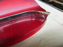 Charger l'image dans la galerie, GM used original Oldsmobile 195 57 tail lamp with chrome bar Shipping include