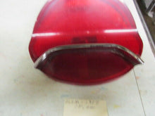 Charger l'image dans la galerie, GM used original Oldsmobile 195 57 tail lamp with chrome bar Shipping include