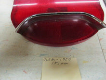 Charger l'image dans la galerie, GM used original Oldsmobile 195 57 tail lamp with chrome bar Shipping include
