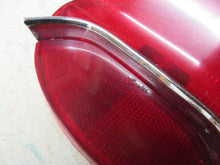 Charger l'image dans la galerie, GM used original Oldsmobile 195 57 tail lamp with chrome bar Shipping include
